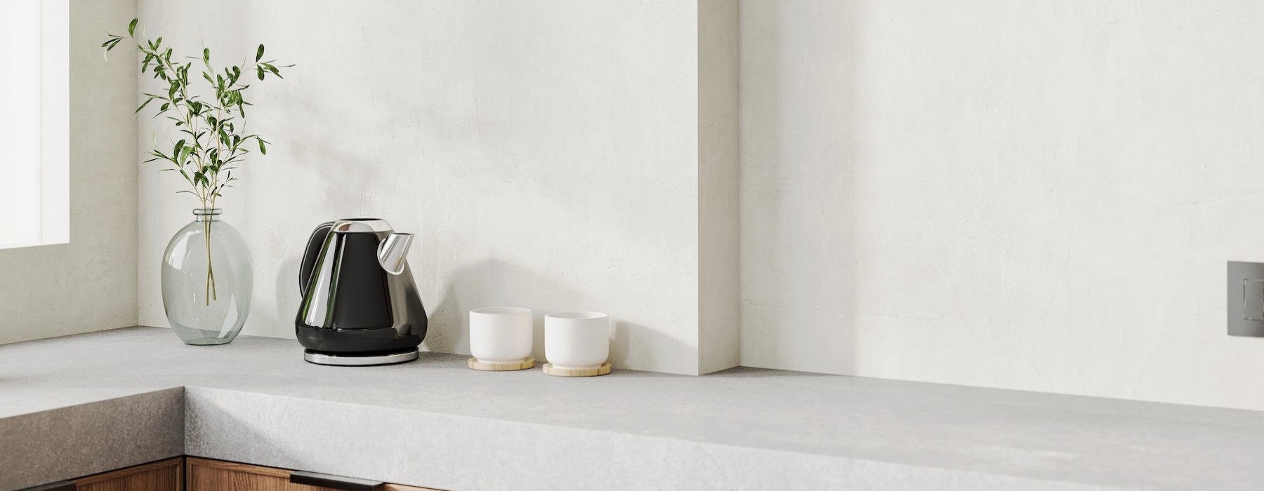a kitchen counter with a coffee maker and cups on it
