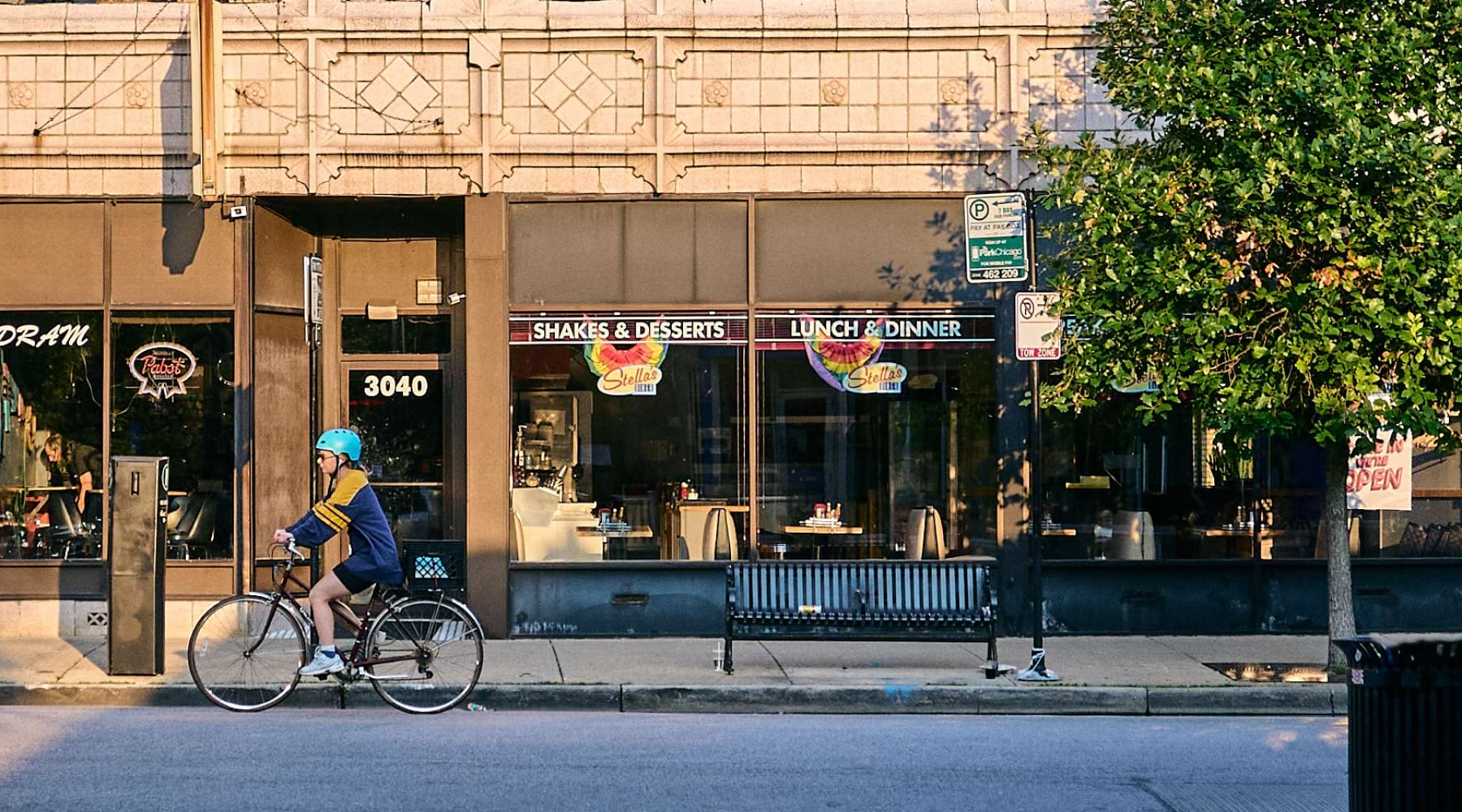 sunlit street with biker